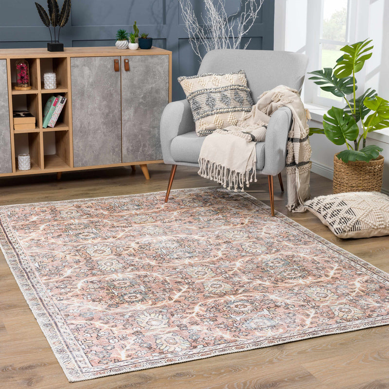 Hauteloom Urpi Rose and Brown washable area rug with floral pattern, soft texture, and decorative design for living space.