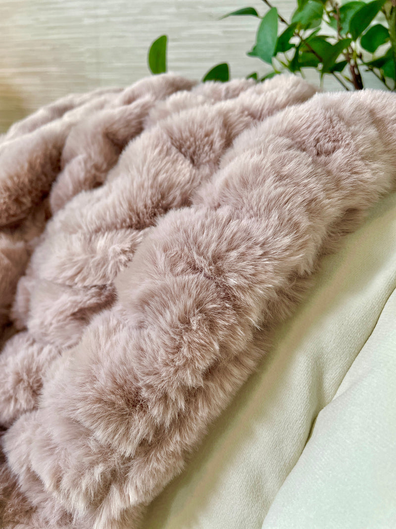 Large Cloud9 blush faux fur blanket, 60x72 inches, soft plush texture, cozy throw blanket displayed on a bed or sofa.