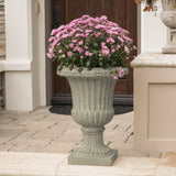 Antique green Italian planter with classic urn style, decorative terracotta pot for indoor or outdoor garden decoration.