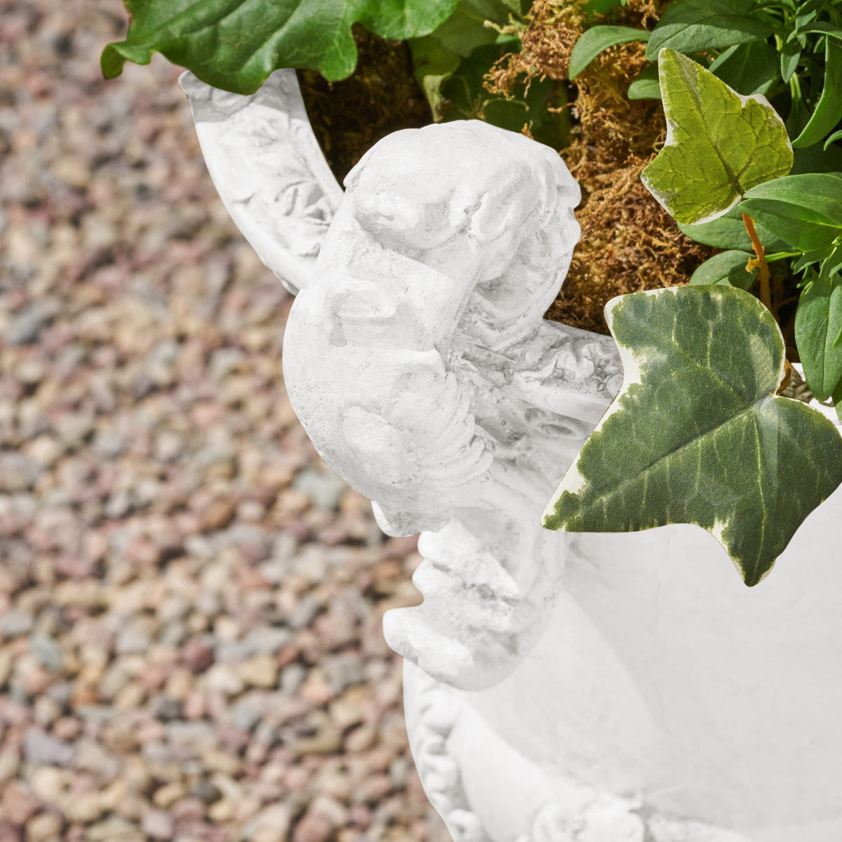 Roman style MGO garden urn planter with drainage hole in antique white finish, ideal for outdoor garden or patio decorating.