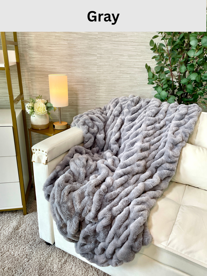 Cloud9 faux fur blanket in medium and large sizes, soft plush texture, cozy throw blanket displayed on a bed or sofa.