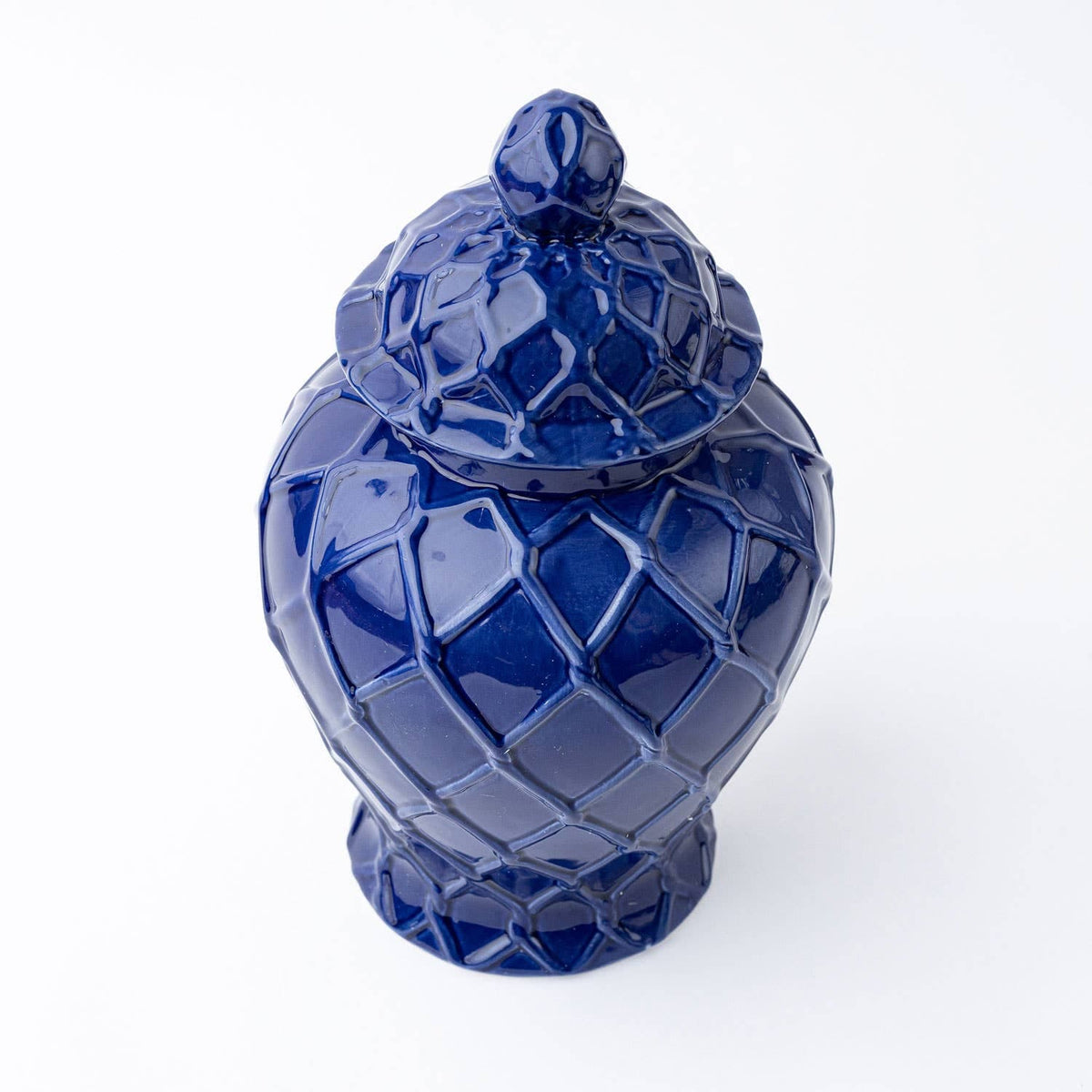 Three navy textured ginger jars in varying sizes, decorative ceramic jars with intricate surface details.