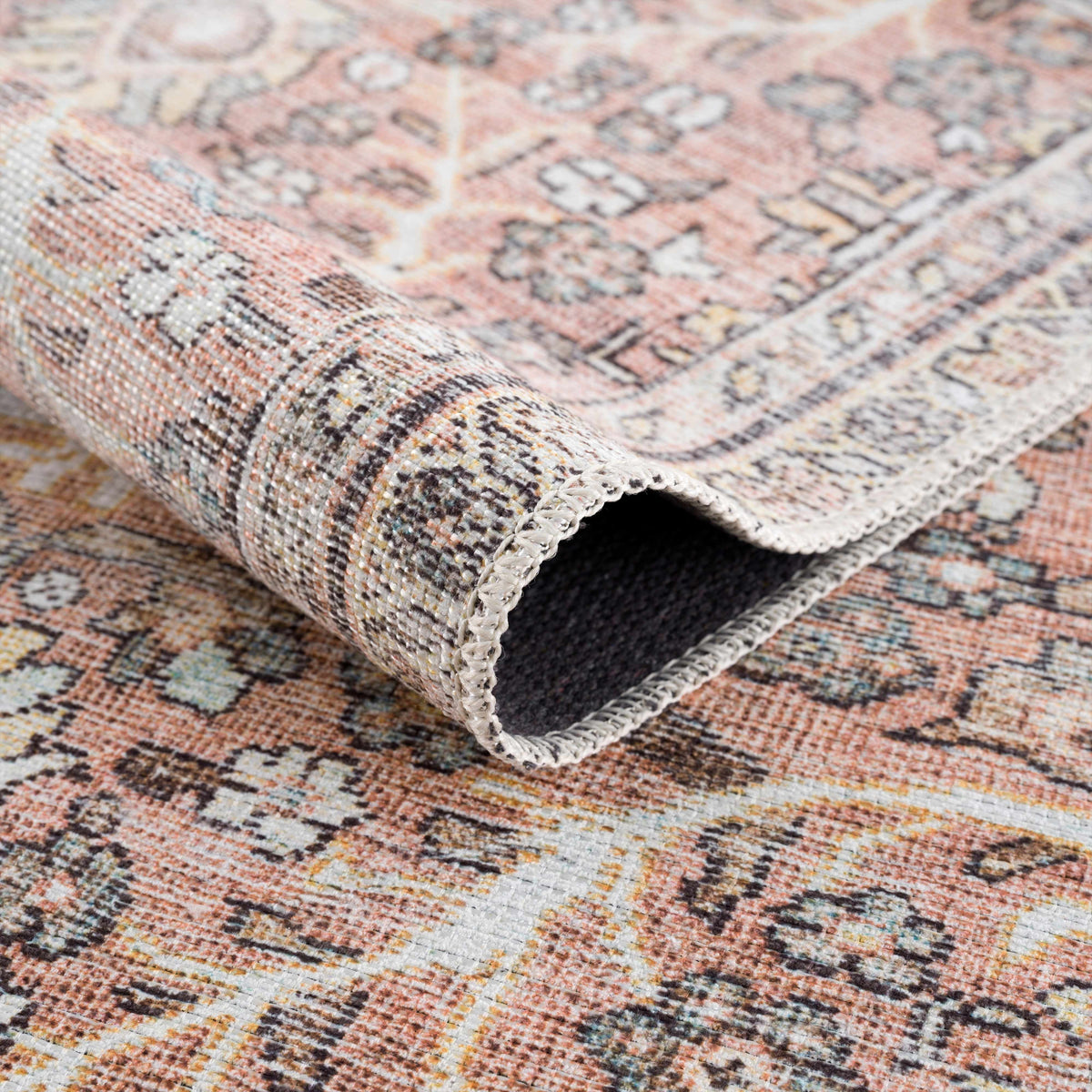 Hauteloom Urpi Rose and Brown washable area rug with floral design, soft texture, perfect for living room or bedroom decor.