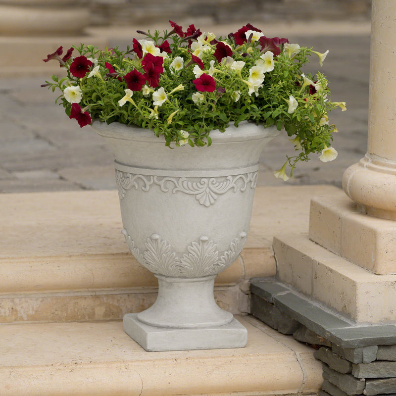 Antique white Moroccan urn planter made of durable magnesium oxide with intricate design for outdoor or indoor use.