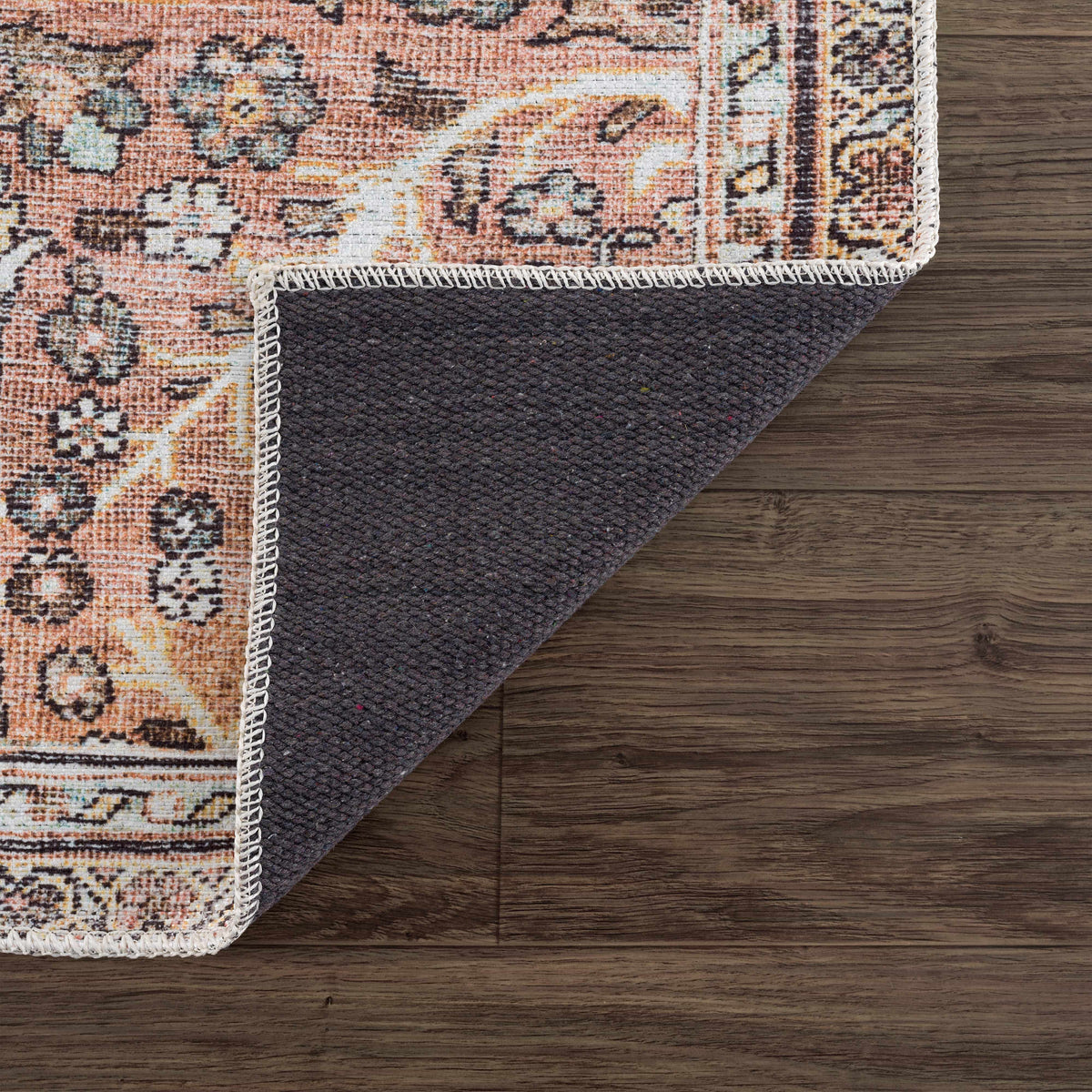 Hauteloom Urpi Rose and Brown washable area rug with floral pattern, soft fabric, and decorative design for living spaces.