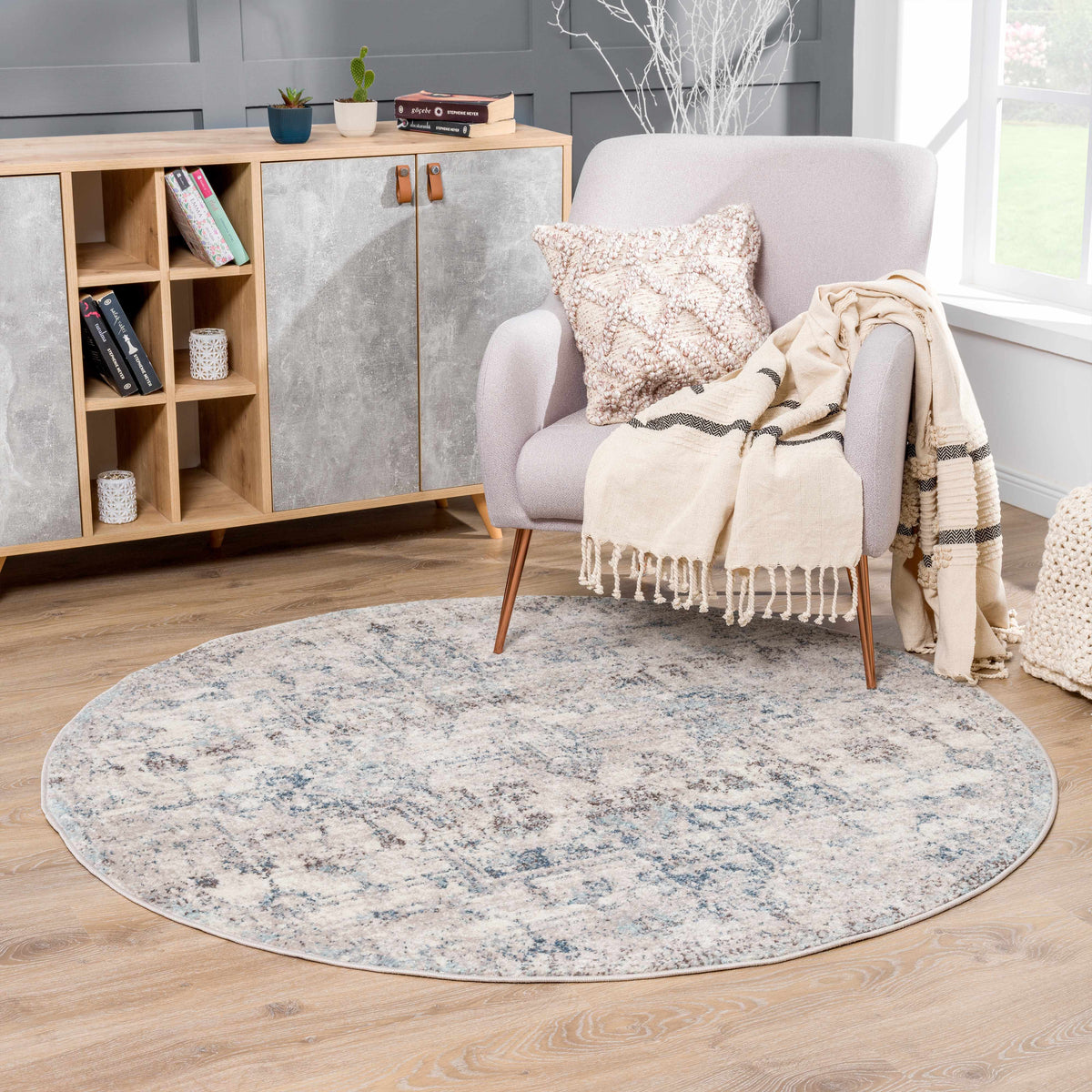 Hauteloom Orrick area rug in a room scene, featuring a textured design in neutral tones on a hardwood floor.