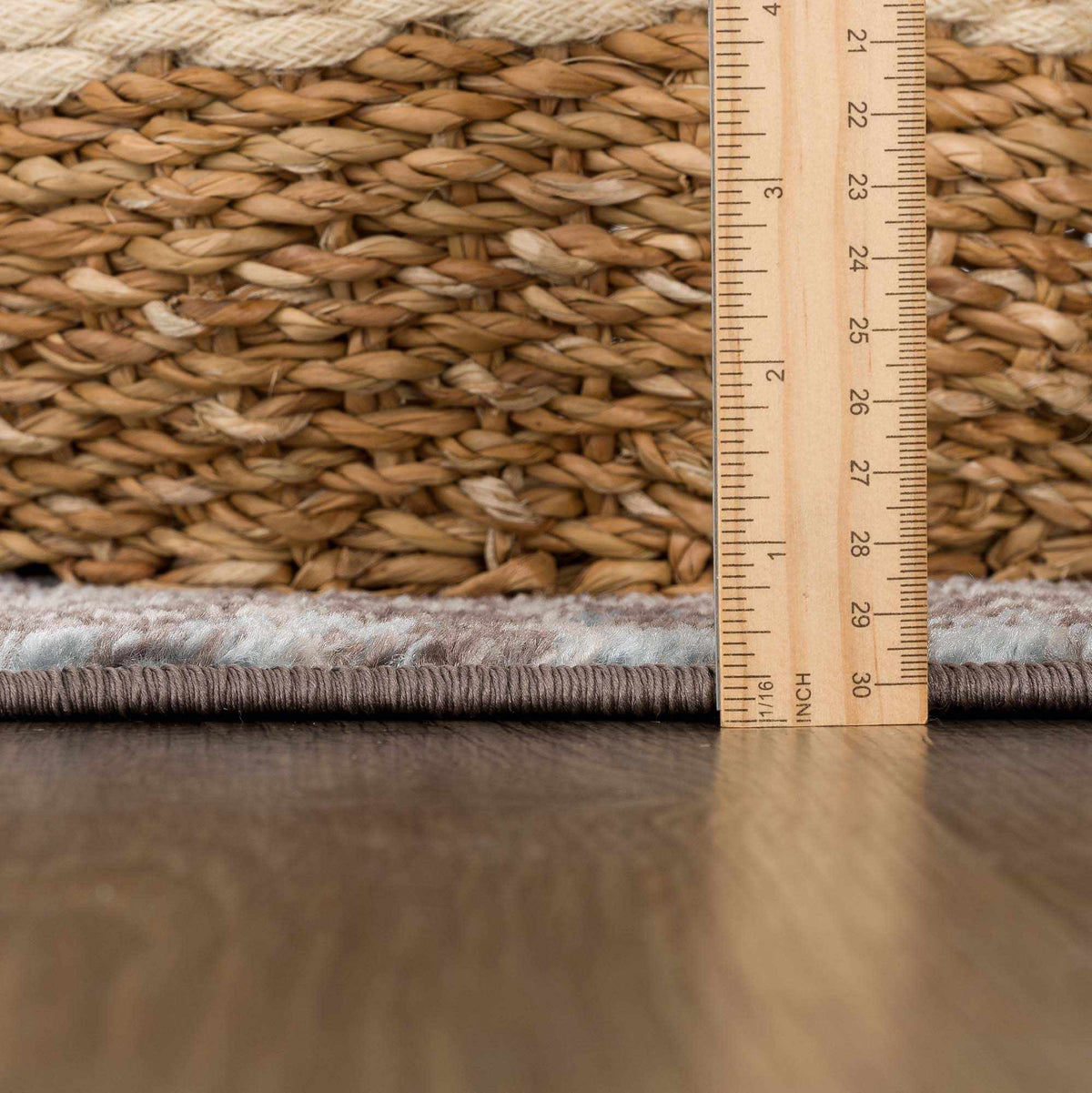 Dark brown medallion area rug from Hauteloom with intricate pattern, featuring a plush pile and detailed design.