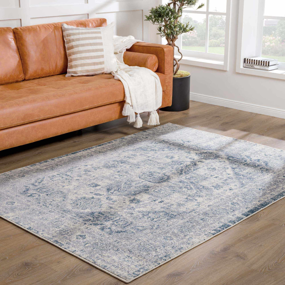 Hauteloom Peeta Gray Blue Medallion area rug displayed in a room scene with intricate medallion pattern and soft gray and blue tones