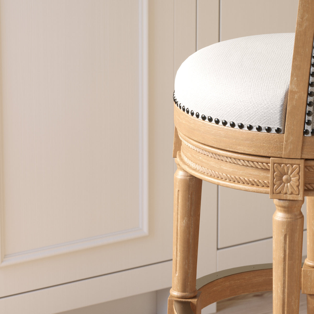 Charlotte Swivel Barstool by Carolina Barstool with weathered oak wood frame and gray fabric upholstery, shown from the back.