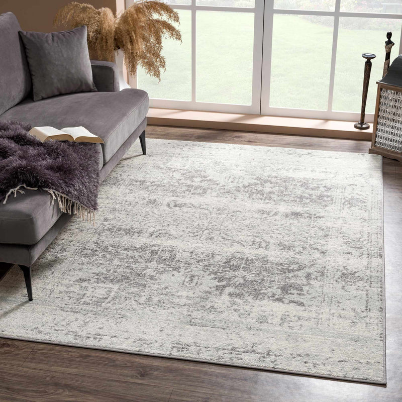 Hauteloom New Rachel area rug with a modern geometric pattern in neutral tones, perfect for living room or bedroom decor.