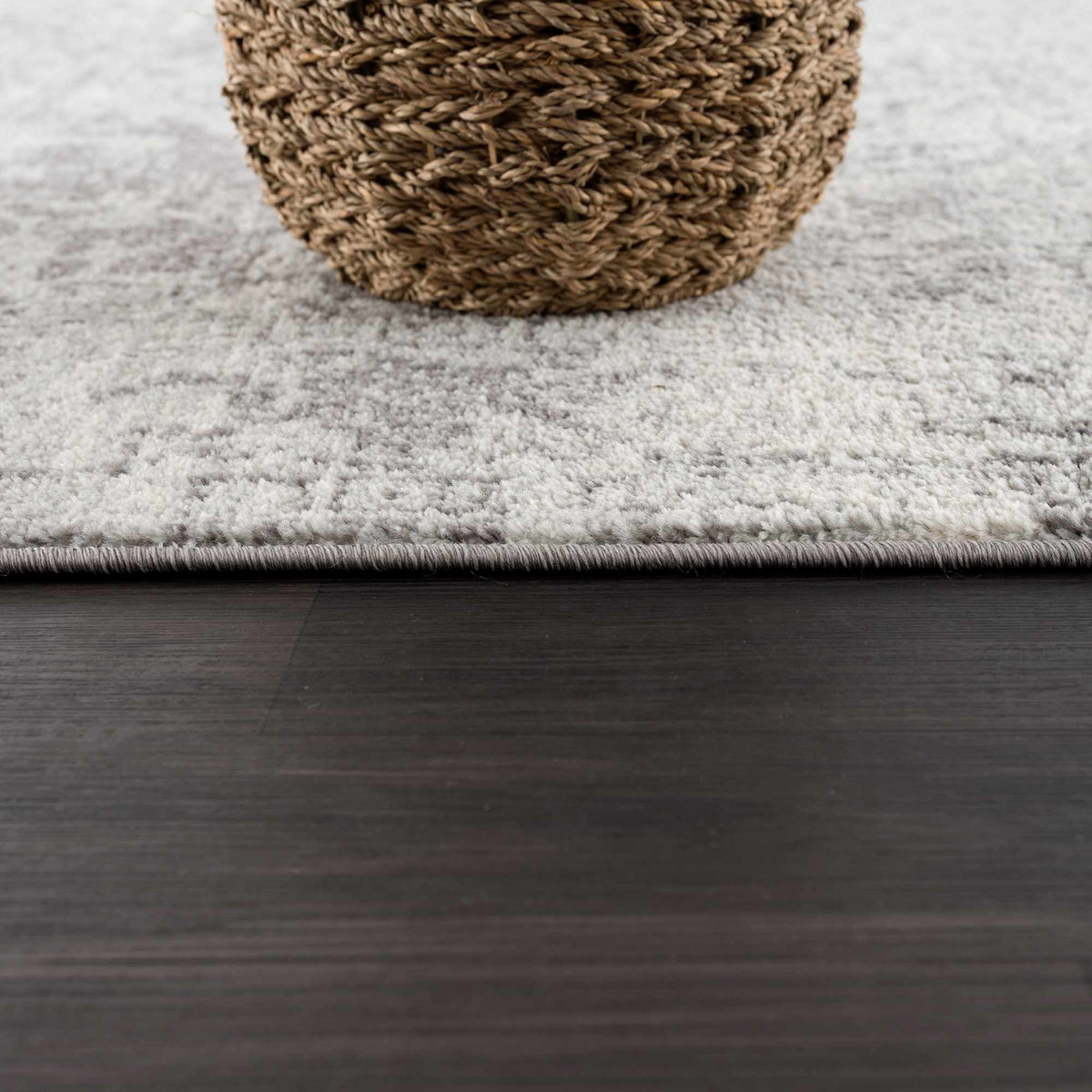 Hauteloom Rachel area rug with intricate geometric patterns in neutral tones, suitable for living room or bedroom decor.