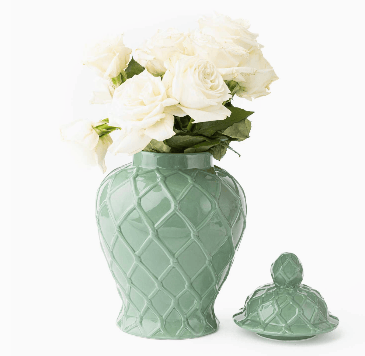 Three green textured ginger jars of varying sizes, featuring intricate patterns, displayed together.
