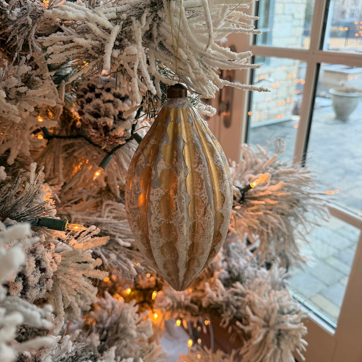Silver and gold drop Christmas ornament, 9 inches, decorative tree decor from Shop Holly J Home, featuring shiny metallic finish.