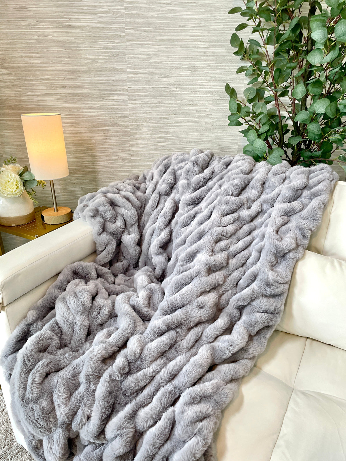 Large gray Cloud9 faux fur blanket, 60x72 inches, showing soft, plush texture and cozy appearance in a home setting.