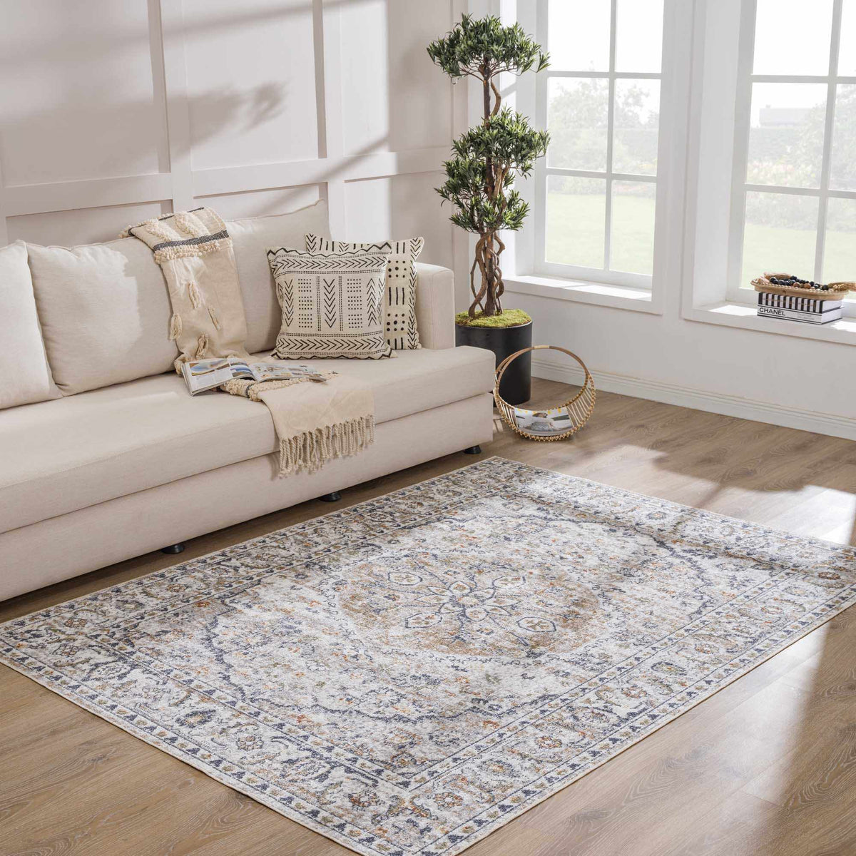Hauteloom Cream Hiti washable area rug displayed in a living room setting, showcasing its soft texture and stylish design.