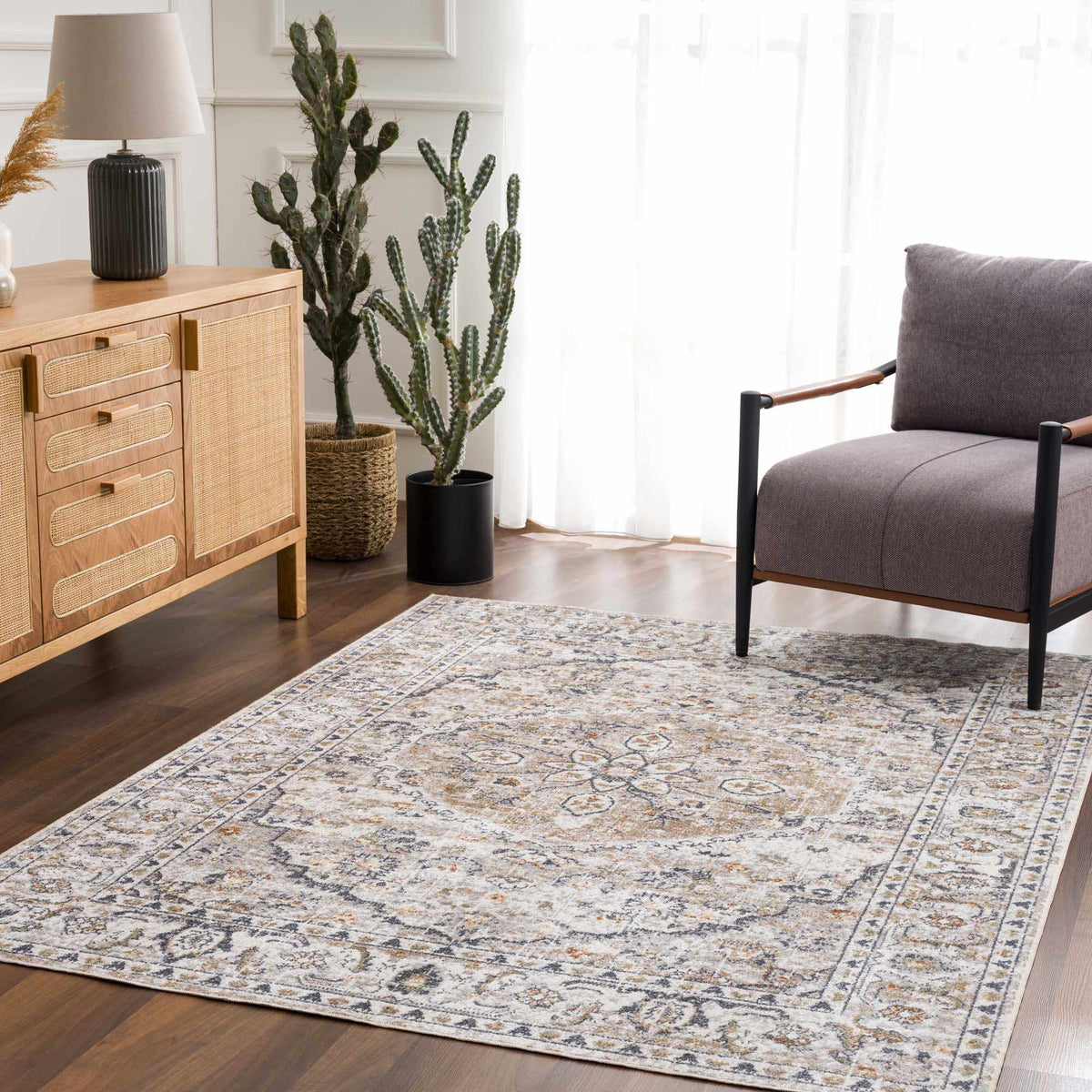 Cream Hauteloom washable area rug spread on a living room floor with furniture and decor in a cozy, modern interior setting.