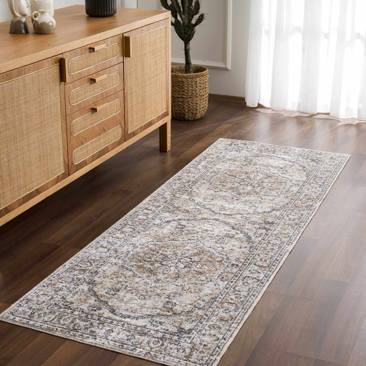 Cream Hiti washable area rug by Hauteloom displayed in a cozy room setting with soft textures and modern decor.