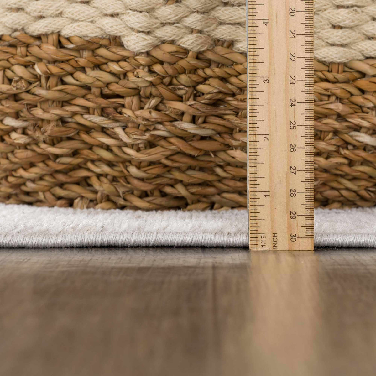 Hauteloom Mudgee Area Rug with textured pile in neutral tones, showcasing intricate woven pattern on a clean background