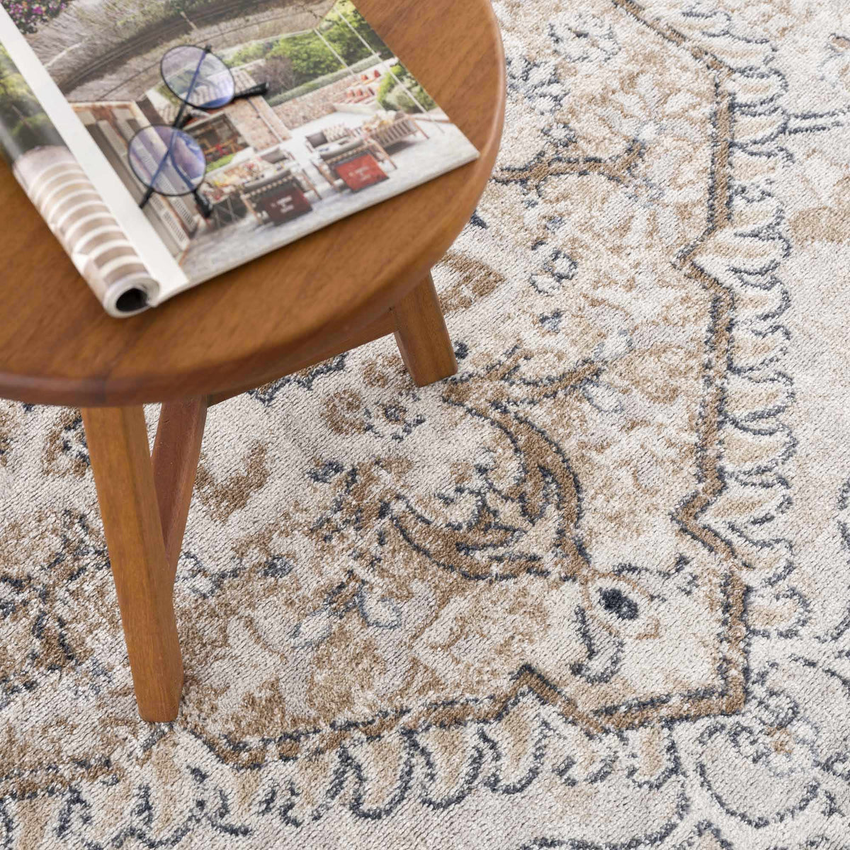 Hauteloom Mudgee Area Rug with intricate patterns in neutral tones, displayed on a stylish living room floor.