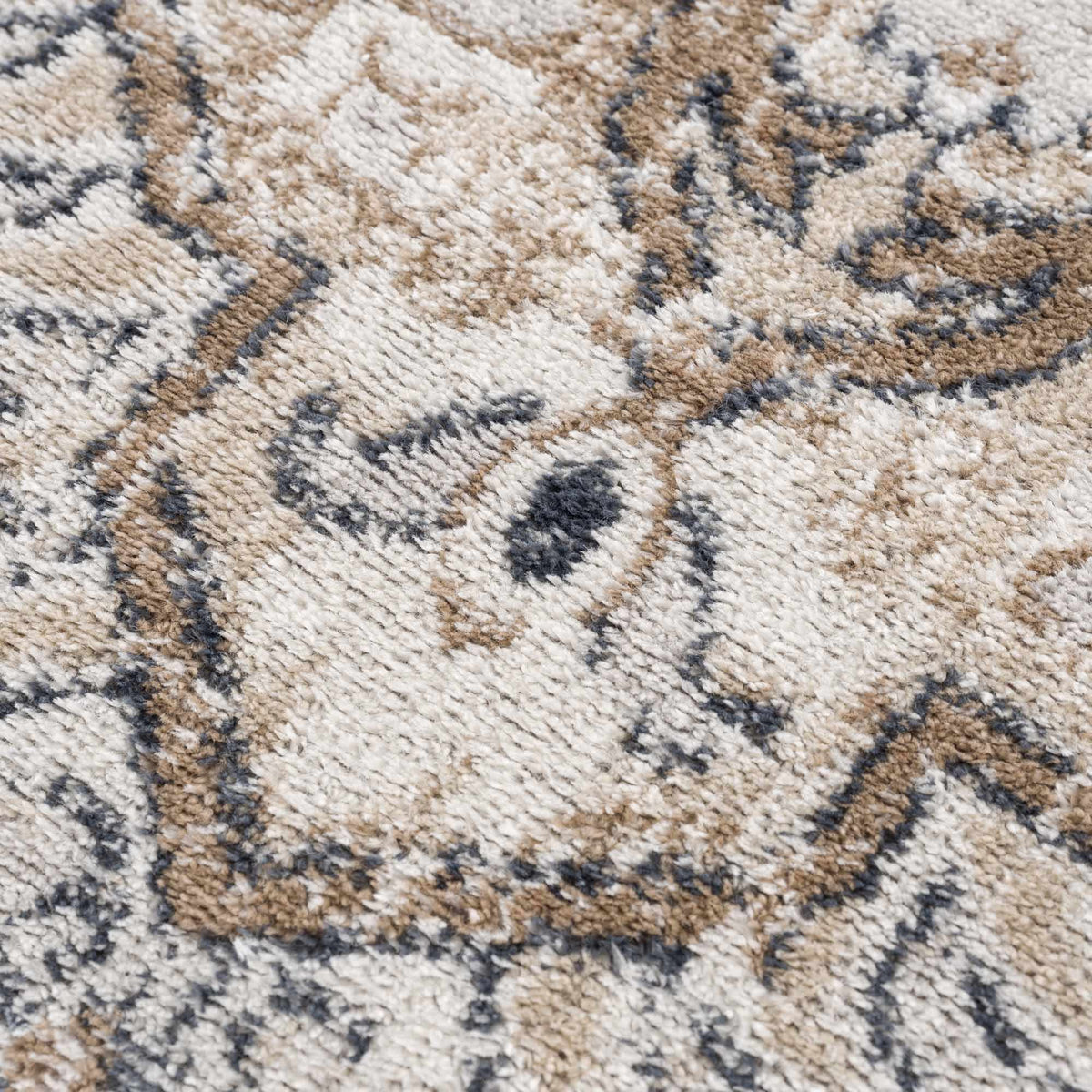 Hauteloom Mudgee Area Rug with textured design in neutral tones, showcasing its soft, woven fabric and intricate pattern.