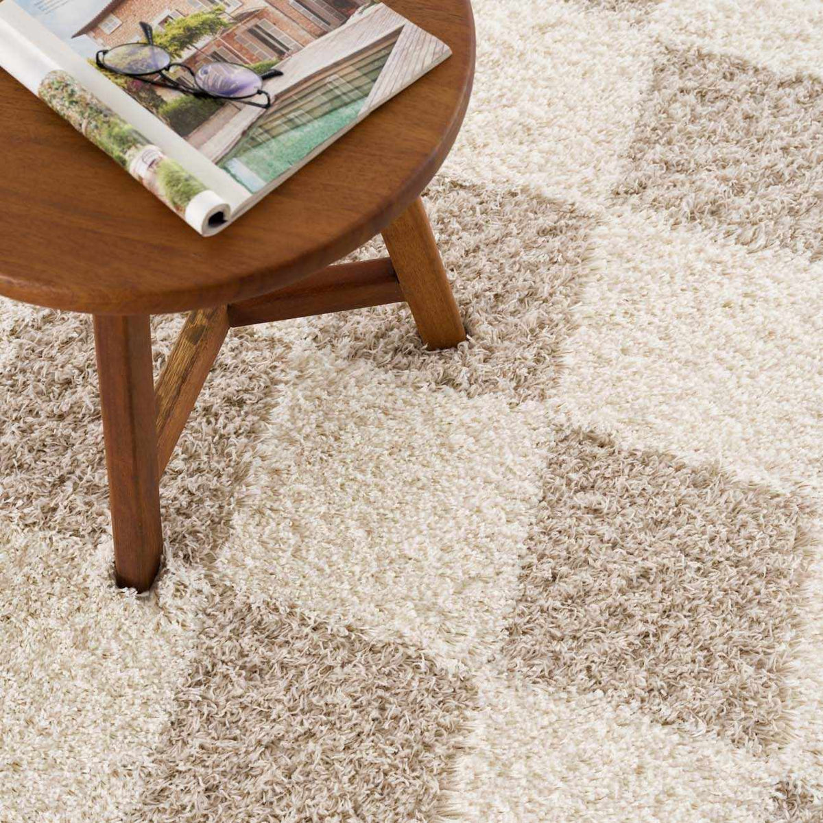 Hauteloom Zahur Cream and Beige Diamond Area Rug with intricate geometric pattern, displayed on a hardwood floor.