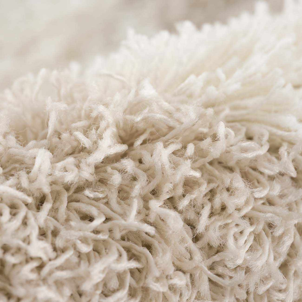 Hauteloom Zahur cream and beige diamond-patterned area rug with textured fabric and intricate design in a modern living space.