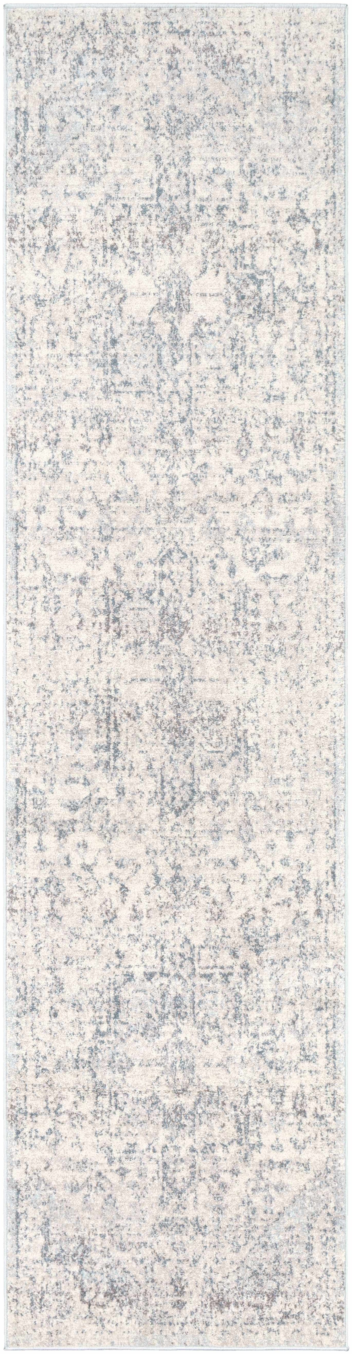 Hauteloom Orrick area rug with geometric pattern in neutral tones, soft textured fabric, perfect for modern living spaces.