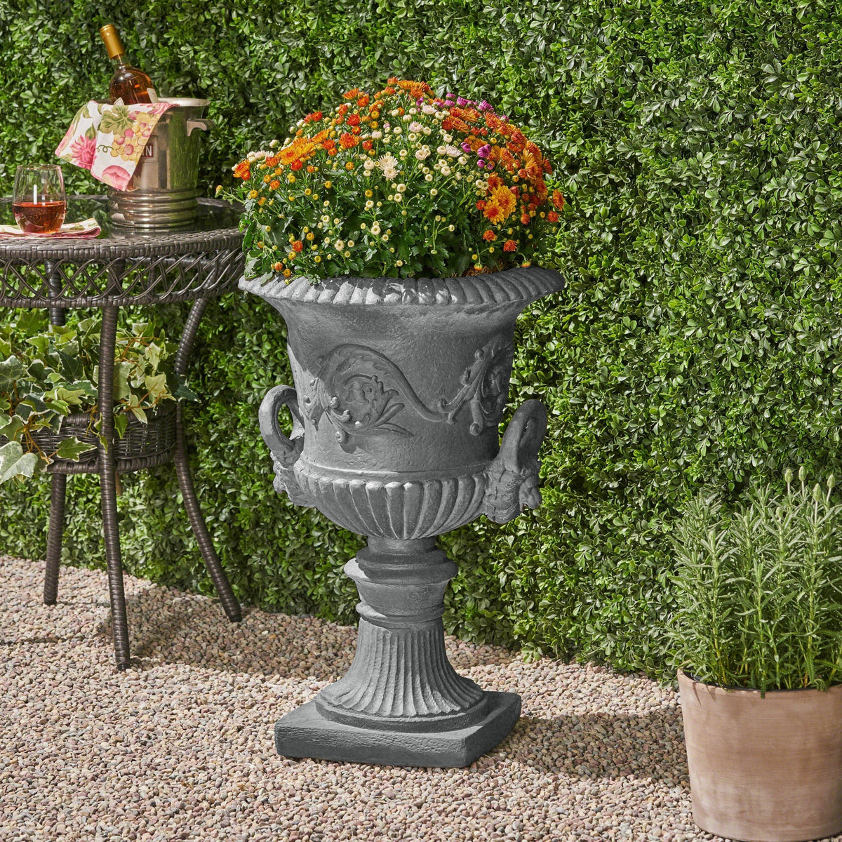 Black Classic Roman MGO Garden Urn Planter with durable magnesium oxide, featuring a traditional Roman design and sturdy construction.