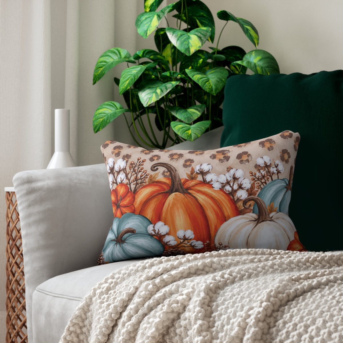 Rustic pumpkin lumbar pillow by BlackbirdOak with blue, orange, and cream fall colors, ideal for cozy home decor.