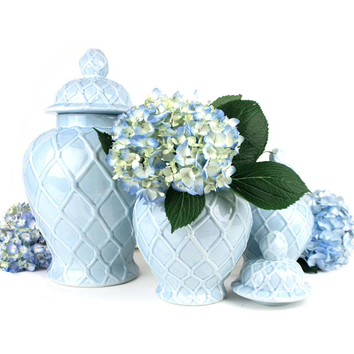 Three light blue textured ginger jars in varying sizes, showcasing decorative ceramic vases from Shop Holly J Home.