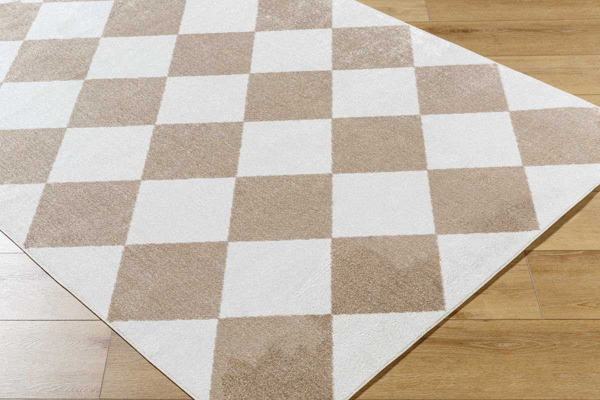 Hauteloom Ulric washable area rug in a corner, featuring a modern design and soft, durable fabric for easy cleaning.