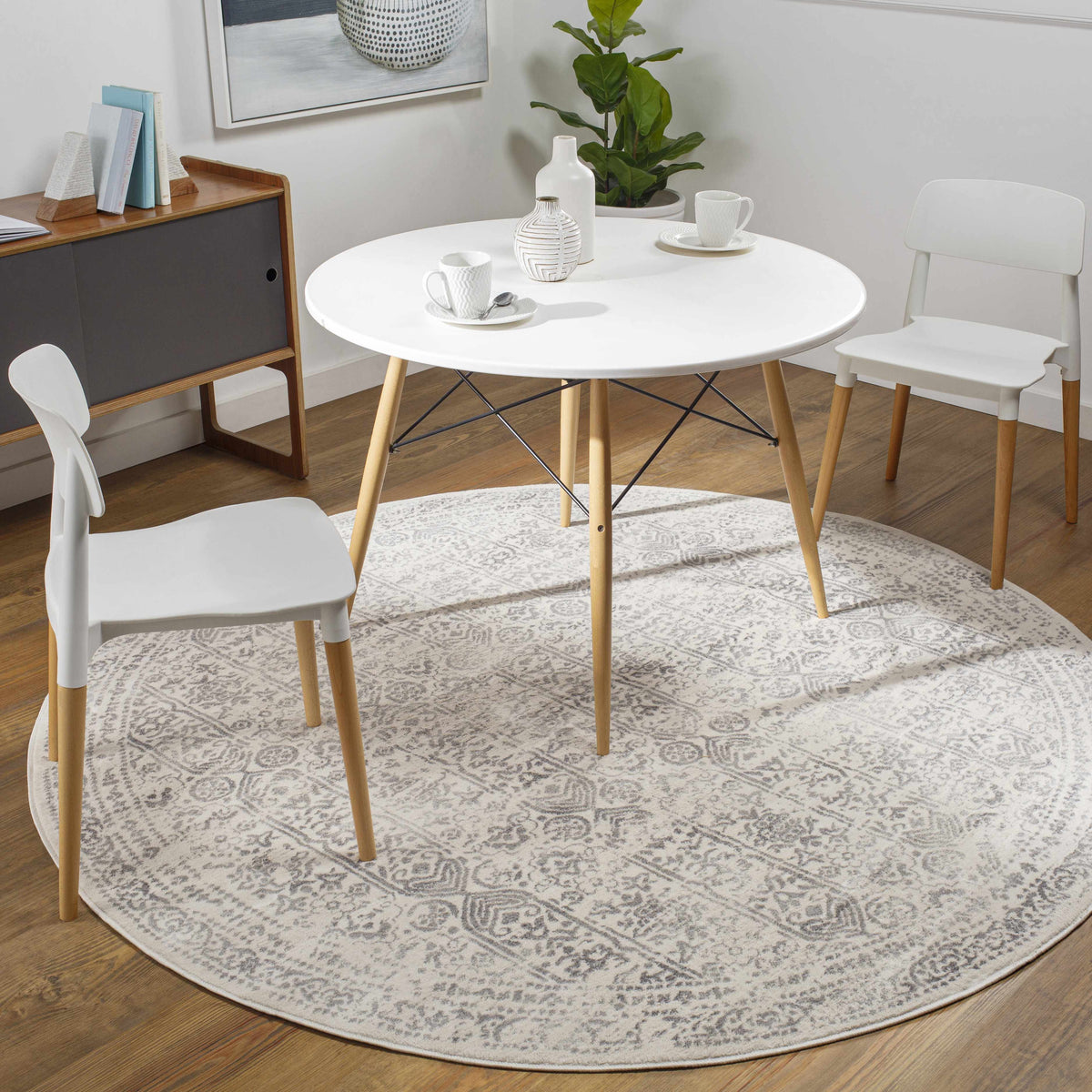 Hauteloom Michie round area rug with intricate pattern, placed in a cozy room setting with furniture and decor.