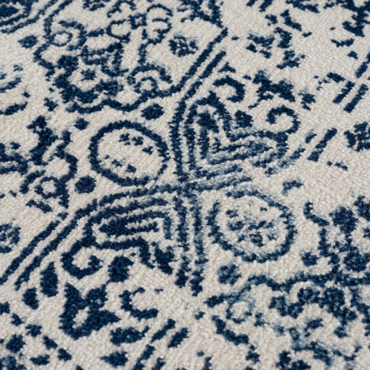 Hauteloom Michie Blue Area Rug with textured pattern, soft woven fabric in vibrant blue for living room or bedroom decor.