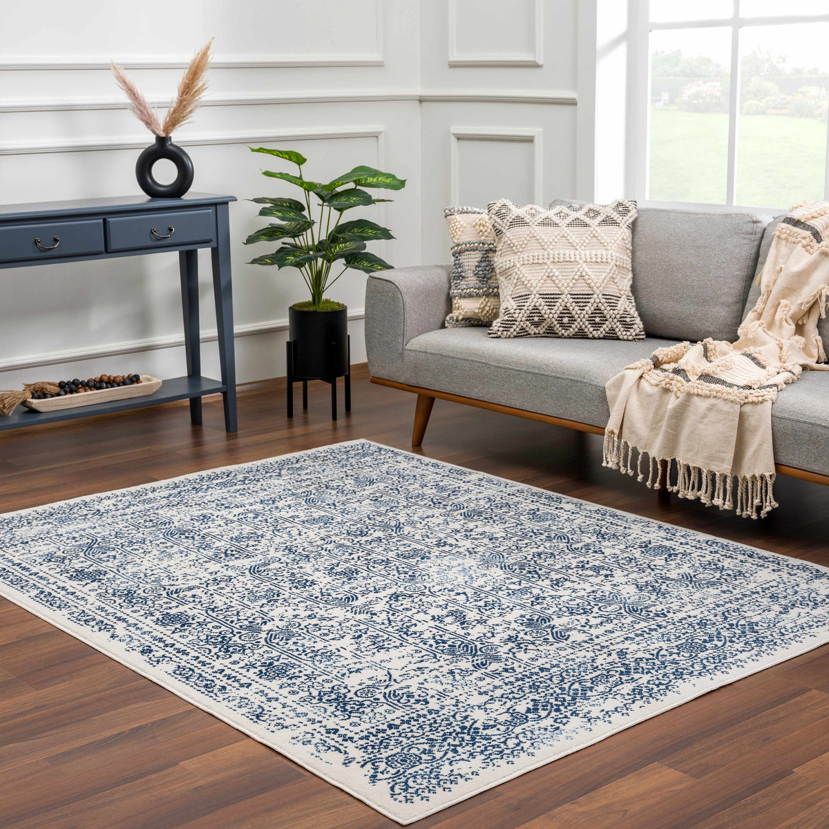 Hauteloom Michie Blue Area Rug displayed in a room setting with furniture and decor, showcasing its vibrant blue pattern and soft texture.