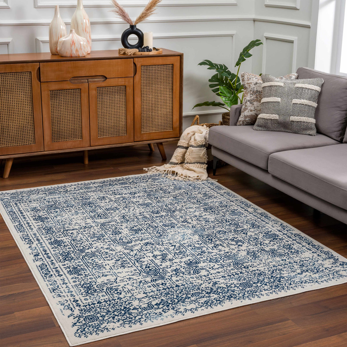 Hauteloom Michie Blue Area Rug in a living room, featuring a soft, patterned design on a hardwood floor.