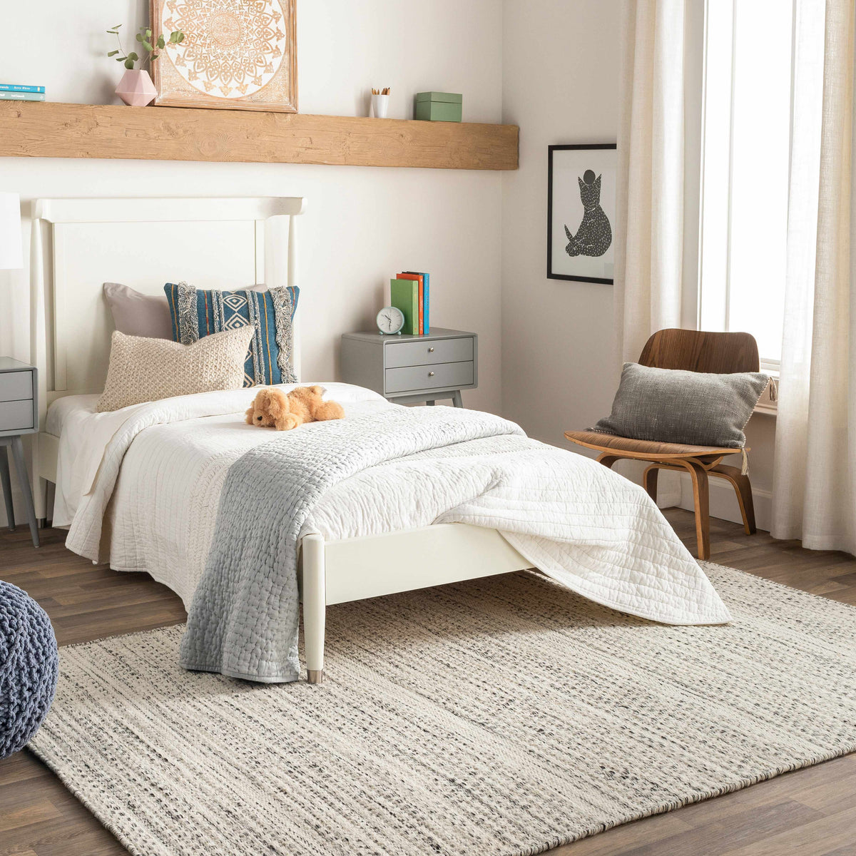 Hauteloom Williford Wool Area Rug in a cozy living room setting with warm tones and textured wool design.
